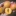 Handful+of+Bentley+Apricots%2C+one+halved+to+show+juicy+orange+flesh+and+free+stone