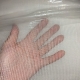 Shows the netting mesh size up against human hand