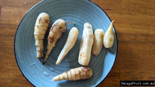 Shows the harvest and cleaned West Indian Arrowroot being displayed on a plate