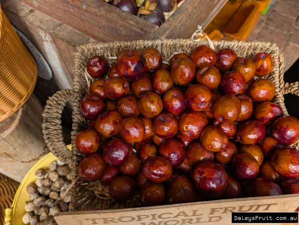 A box of jujube fruit at a market