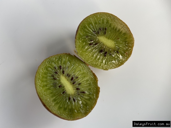 Female Sweetie Kiwifruit ripe and ready to eat cut in half