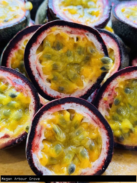 Halved Passionfruit showing juicy segments and bright colour