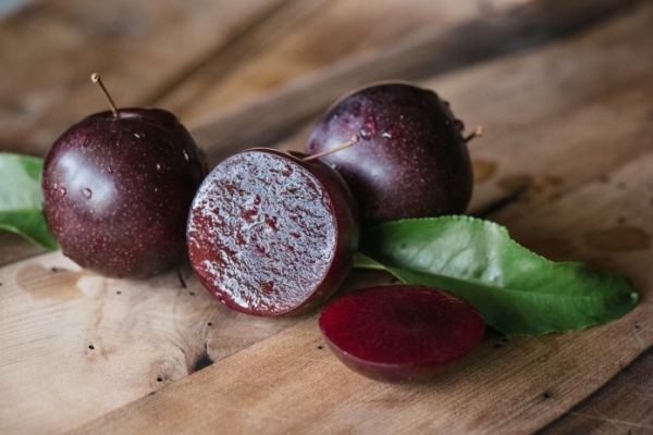 Close up of the A-Okay (TM) Fruit split open showing the flesh