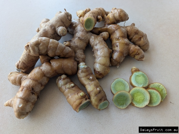 Black Turmeric rhizomes sliced to show dark centers