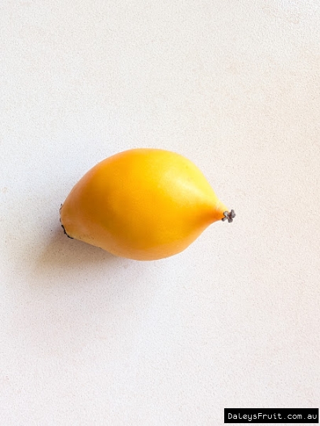 Halved sweet yellow mangosteen, ripe, soft fruit.